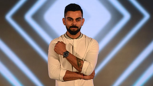 ক্রিকেটের বাইরে থাকায় বিজ্ঞাপনী সংস্থার প্রচারে সময় কাটছে কোহলির। ছবি: এএফপি