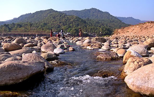 ছোট-বড় পাথরের মাঝ দিয়ে গড়িয়ে পড়ছে পাহাড় থেকে নেমে আসা স্বচ্ছ পানি।