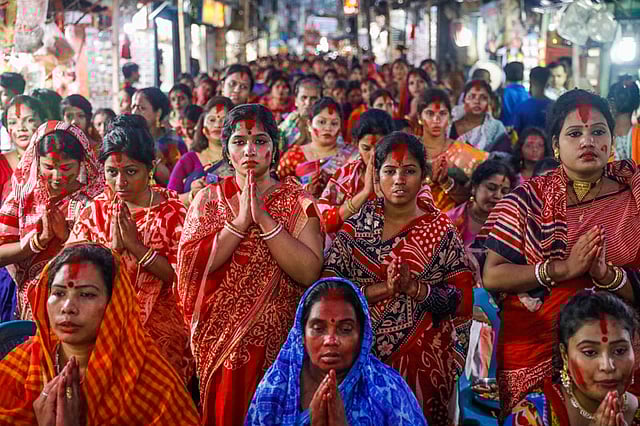 বিপদনাশিনী পূজায় প্রার্থনারত ভক্তরা।