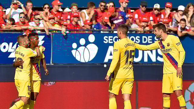 গোলের পর ফাতিকে নিয়ে সতীর্থদের উল্লাস। ছবি: এএফপি