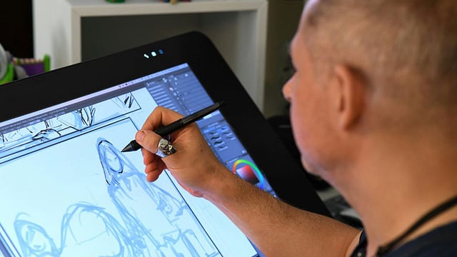 ‘ইগনাইটেড’–এর চরিত্র আঁকছেন ফিলিপ ব্রিয়োনেস। ছবি: এএফপি