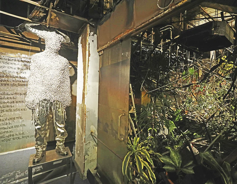 A metallic sculpture is displayed on the ground floor of the building as part of the exhibition.