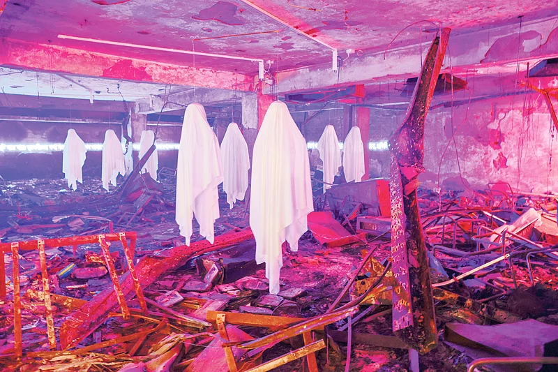 On the first floor of the Prothom Alo building, everything has been reduced to charred remains, while an installation artwork created through projected light transforms the burned space.