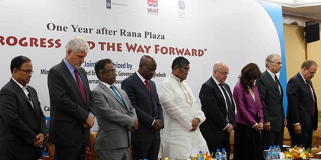 Guests at a function titled ‘One Year after Rana Plaza: Progress and the way Forward’ remain silent for a minute at ruposhi Bangla Hotel in Dhaka on Thursday to show respect to people who were killed at the Rana Plaza building collapse. Photo: Hasan Raza