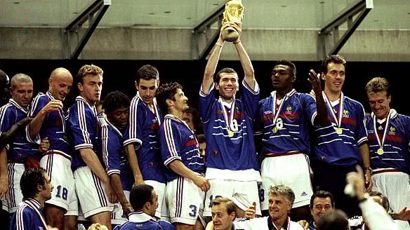 French Team Led By Zinedine Zidane Take Turns To Hoist The World Cup Trophy. Photo: Reuters
