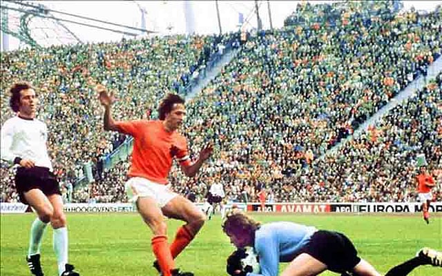 West German goalkeeper Sepp Maier catches the ball in front of Dutch forward Johan Cruijff as defender Franz Beckenbauer (L) looks on, 07 July 1974 in Munich, during the World Cup soccer final. Host West Germany beat The Netherlands 2-1 to earn its second World Cup title, twenty years after its first win over Hungary (3-2), 04 July 1954 in Bern. AFP