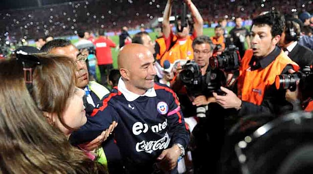 Chilean national football team coach, Argentinian Jorge Sampaoli celebrates after their Brazil 2014 FIFA World Cup South American qualifier match against Ecuador, in Santiago, on October 15, 2013. AFP