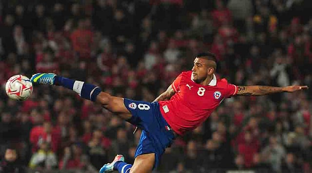 Chile's Arturo Vidal kicks the ball during their FIFA World Cup Brazil 2014 South American qualifier football match against Bolivia at the Nacional stadium in Santiago, Chile,on June 11, 2013. AFP