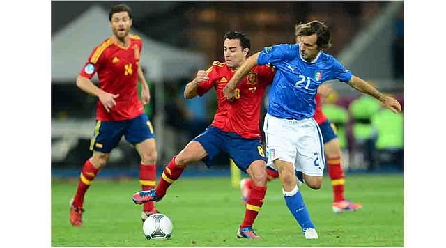 Italian midfielder Andrea Pirlo (R) vies with Spanish midfielder Xavi Hernandez during the Euro 2012 football championships final match Spain vs Italy on July 1, 2012 at the Olympic Stadium in Kiev. AFP