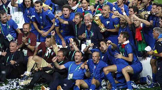 The Italian team celebrate with the trophy after the World Cup 2006 final football game Italy vs.France, 09 July 2006 at Berlin stadium. Italy won the 2006 football World Cup by defeating France on penalties. Italy won the 2006 football World Cup by defeating France on penalties. AFP