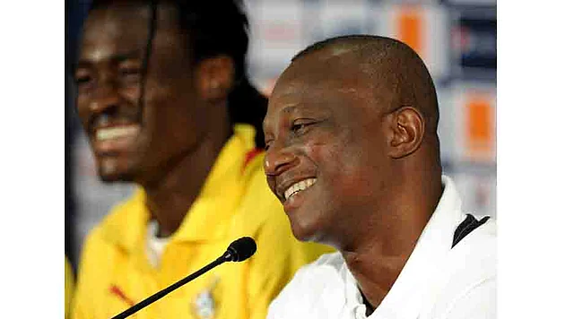 Ghana's national football team head coach Kwesi Appiah (R), flanked by midfielder Derek Boateng, give a press conference at Nelson Mandela Bay Stadium in Port Elizabeth on January 26, 2013, two days before a 2013 African Cup of Nation Group B football match against Niger. AFP