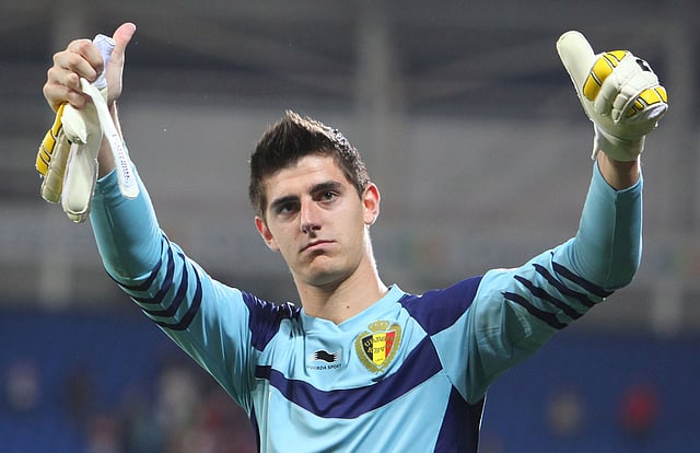 Belgian Goalkeeper Thibaut Courtois salutes fans at the end of the 2014 World Cup Qualifying football match between Wales and Belgium at Cardiff City Stadium, Cardiff, Wales, on September 7, 2012. Belgium won 2-0. AFP