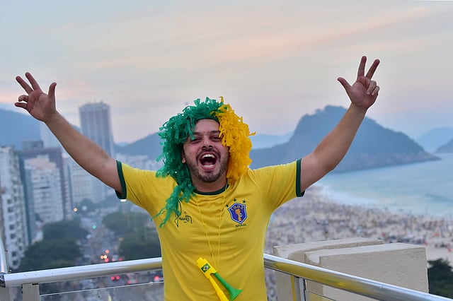 A fan of Brazil celebrates on a terrace in Copacabana, Rio de Janeiro on June 28, 2014, after the Round of 16 football match at the Mineirao Stadium in Belo Horizonte. Photo: AFP