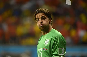 Netherlands' goalkeeper Tim Krul celebrates after saving a penalty kick during the penalty shootout after the extra time in the quarter-final football match between Netherlands and Costa Rica at the Fonte Nova Arena in Salvador during the 2014 FIFA World Cup on July 5, 2014. AFP