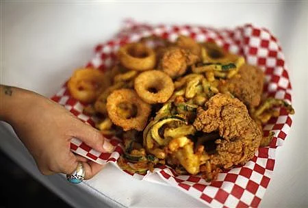 If you eat everything you put on your plate, you are a member of 'Clean Plate Club'. Photo: Reuters