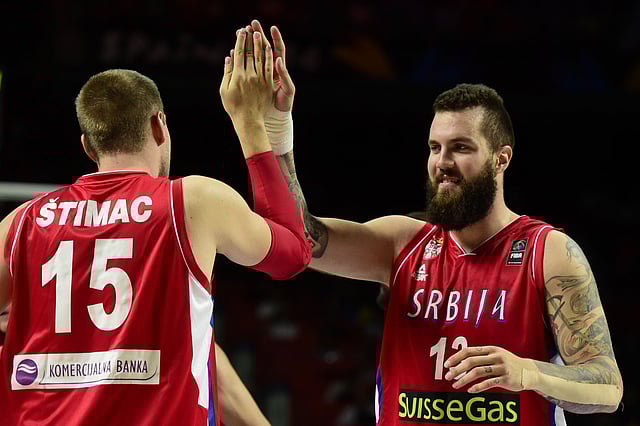 Serbia's centre Miroslav Raduljica (R) and Serbia's centre Vladimir Stimac celebrate a point during the 2014 FIBA World basketball championships semifinal match France vs Serbia at the Palacio de los Deportes in Madrid on September 12, 2014. Photo: AFP
