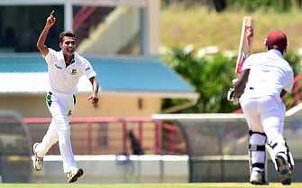 Bangladesh bowler Shaiful Islam reacts after bowling out Kemar Roach of the West Indies, caught out by wicketkeeper Mushfiqir Rahim, on day two of the second and final Test between West Indies and Bangladesh on September 14, 2014 at the Beausejour Cricket Cricket Ground in Gros Islet, St Lucia. AFP