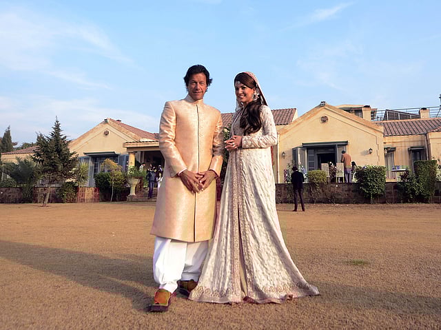 Pakistani opposition leader Imran Khan (L) and new wife Reham Khan pose for a photograph during their wedding ceremony at his house in Islamabad on January 8, 2015. AFP