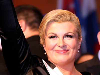 The presidential candidate of the conservative Croatian Democratic Union, Kolinda Grabar-Kitarovic (C), celebrates after hearing the first results of the Croatian presidential elections in Zagreb. AFP