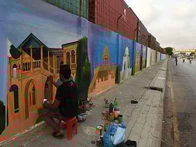 : Pakistani artists and volunteers paint designs on a wall in the southern port city of Karachi. Photo: AFP