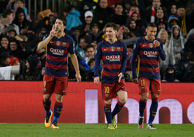 Barcelona's Uruguayan forward Luis Suarez (L) celebrates his goal with Barcelona's Argentinian forward Lionel Messi (C) and Barcelona's Brazilian forward Neymar (R) during the UEFA Champions League Round of 16 second leg football match FC Barcelona vs Arsenal FC at the Camp Nou stadium in Barcelona on March 16, 2016. AFP