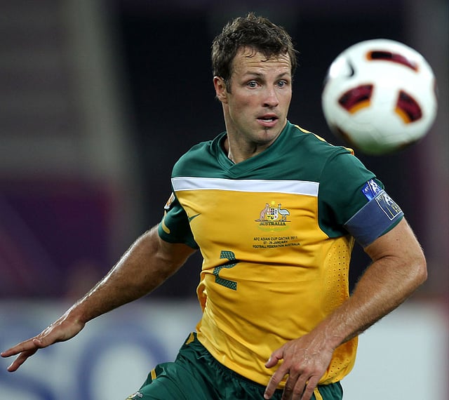 A file photo taken on 29 January, 2011, shows Australia`s defender Lucas Neill controlling the ball during the 2011 Asian Cup final football match between Australia and Japan at Khalifa Stadium in the Qatari capital Doha. Photo: AFP