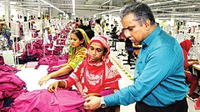 Managing director Fazlul Haque of Plummy Fashions checks a product at his factory. The factory topped in green knitwear. Photo: Zia Islam