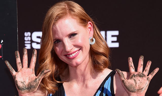 Actress Jessica Chastain displays her hands after imprinting her handprints in the block of cement at her Hand and Footprint Ceremony at the TCL Chinese Theater in Hollywood, California, on 3 November, 2016. Photo: AFP