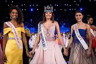 First runner up Miss Dominican Republic Yaritza Miguelina Reyes Ramirez (L); Miss World 2016 Stephanie Del Valle of Puerto Rico (C); and second runner up Miss Indonesia Natasha Mannuela (R) stand together after Del Valle's win in the Miss World 2016 pageant at the MGM National Harbor December 18, 2016 in Oxon Hill, Maryland. AFP
