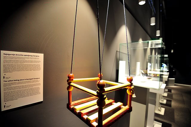 A child's swing displayed at Sarajevo's newly opened 'War Childhood Museum'. Ballet slippers, tinned food and drawings by a sister killed from shelling are found among the objects in a new Sarajevo museum used to tell stories of life during Bosnia's war through the eyes of children. Photo: AFP