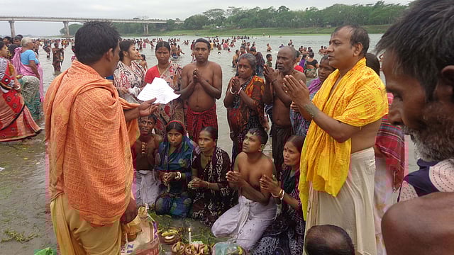 Hindu devotees throng old Brahmaputar river on the occasion of Ashtami Snan (holy bath) on Tuesday. Photo: Prothom Alo