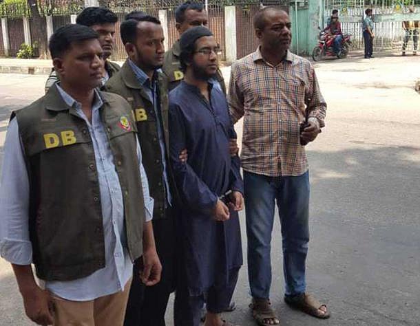 Police introduce this person (R2-hanscuffed) as detained ABT IT chief, Ashfaq-Ur-Rahman. Photo: Saddam Hossain