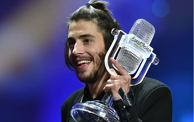 Portuguese singer representing Portugal with the song “Amar Pelos Dios” Salvador Vilar Braamcamp Sobral aka Salvador Sobral gestures after winning the final of the 62nd edition of the Eurovision Song Contest 2017 Grand Final at the International Exhibition Centre in Kiev. Photo: AFP