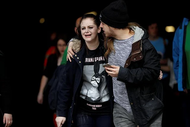 People rush out of the Arndale shopping centre as it is evacuated in Manchester, Britain 23 May, 2017. Photo: Reuters