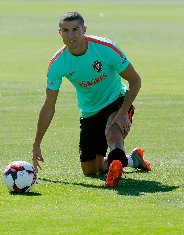 Portugal`s forward Cristiano Ronaldo warms up during a training session at `Cidade do Futebol` training camp in Oeiras, outskirts of Lisbon, on June 7, 2017 on the eve of the World Cup championship 2018 qualifier match against Latvia. AFP
