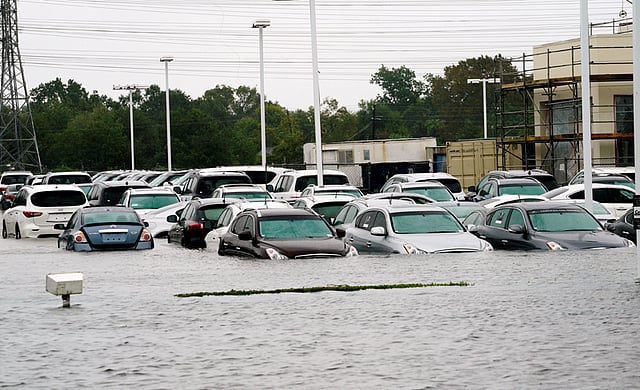 A car dealership is covered by Hurricane Harvey floodwaters near Houston. Photo: AFP