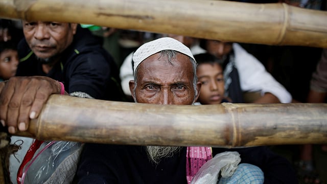 A Rohingya refugee waits for a blanket distribution at the Balukhali camp near Cox`s Bazar, Bangladesh on 11 December 2017. Reuters