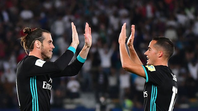 Real Madrid’s Welsh forward Gareth Bale (L) is congratulated after scoring by teammate Spanish forward Lucas Vázquez ® during the FIFA Club World Cup semi-final match in the Emirati capital Abu Dhabi on Wednesday. Photo: AFP