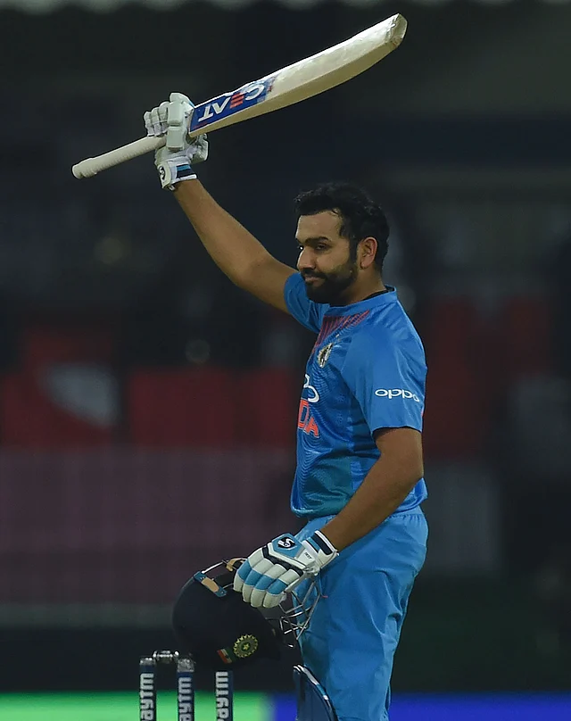Indian captain Rohit Sharma celebrates after scoring his century during the second T20 international cricket match between India and Sri Lanka at the Holkar Stadium in Indore on 22 December, 2017. Photo: AFP