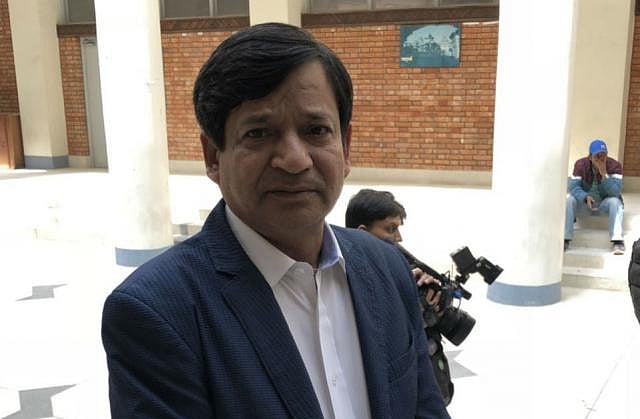 Cap 2: US-Bangla airliner co-pilot Prithula Rashid’s grandfather is seen waiting in front of the morgue of the Kathmandu Medical College Teaching Hospital. Photo was taken by Kamrul Hasan on Wednesday.