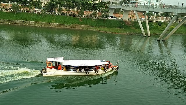 The sound of the water taxies cruising through the Hatirjheel lake has become a familiar sound to the kids swimming there. Photo: Nusrat Nowrin