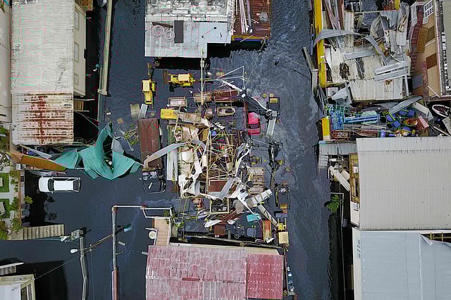 An aerial view shows the flooded neighborhood of Juana Matos in the aftermath of Hurricane Maria in Catano, Puerto Rico on 22 September. Photo: AFP