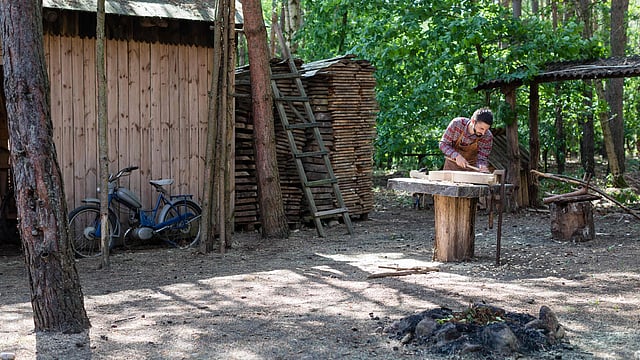Polish musician and instrument-maker Mateusz Raszewski shapes a kalisz bass at his workshop on 10 May 2018 in the village of Kamiensko, just north of the western Polish city of Poznan. Photo: AFP