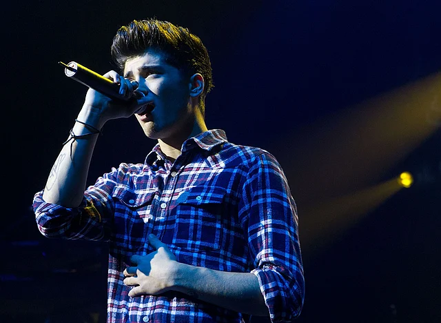 In this file photo taken on 22 April, 2012 Zayn Malik of the British-Irish boy band One Direction performs during the group`s concert at the St James theatre in Wellington. Photo: AFP