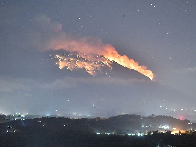 Mount Agung volcano erupts during the night, as seen from Bugbug village in Karangasem regency in Bali, Indonesia on 2 July. Photo: Reuters