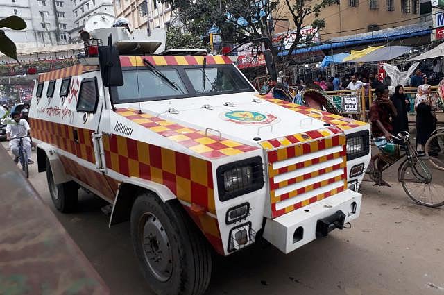 Police patrol with an armour vehicle at Mirpur-10 on Sunday. Photo: Abdus Salam