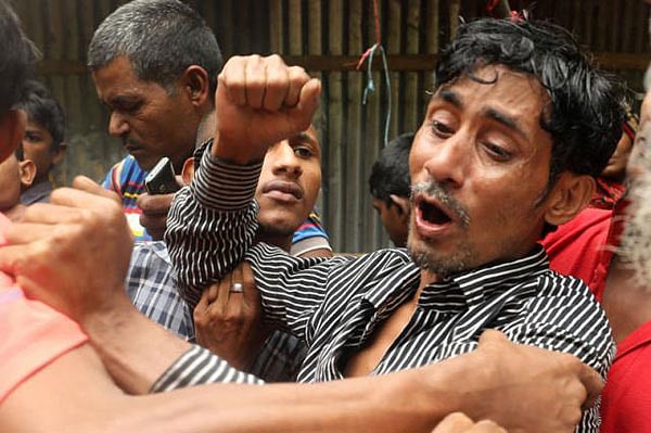 Relative of a deceased killed in Chattogram landslide seen crying. Photo: Sourav Das