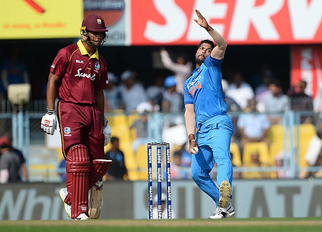 Indian cricket team bowler Umesh Yadav (R) bowls during the first one day international (ODI) cricket match between India and West Indies at Barsapara Cricket Stadium in Guwahati on 21 October 2018. Photo: AFP