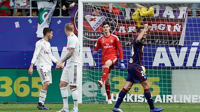 Eibar`s Joan Jordan celebrates their third goal as Real Madrid`s Thibaut Courtois and team mates look dejected in a La Liga match at Ipurua, Eibar, Spain on 24 November 2018. Photo: Reuters