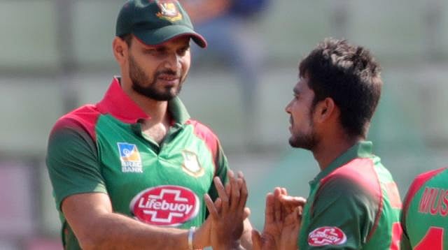 Bangladesh skpper Mashrafe Mortaza congratulates Mahidy Hasan. Photo: Shamsul Huq